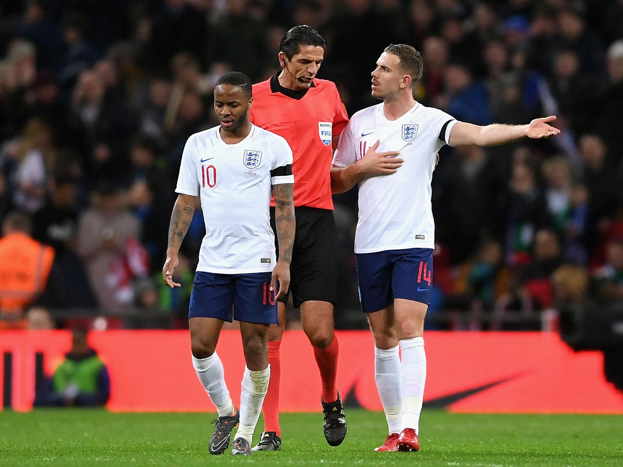 Jordan Henderson remonstrates with the referee after Italy's penalty