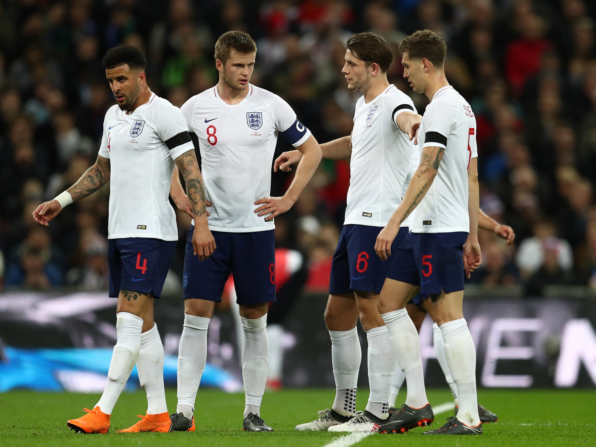 James Tarkowski (second right) conceded a penalty on his England debut to allow Italy to equalise