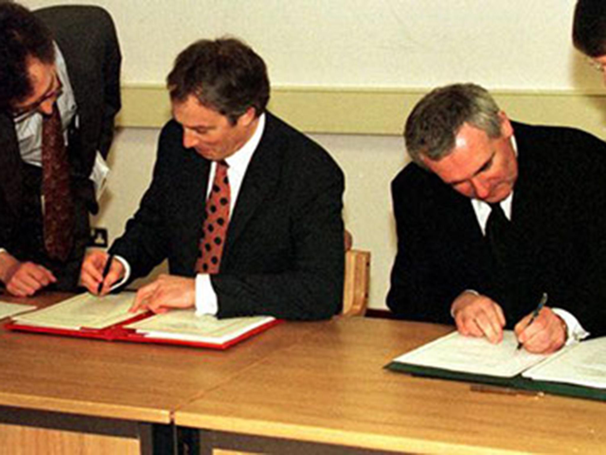 Prime Minister Tony Blair and Taoiseach Bertie Ahern sign the Good Friday Agreement in 1998