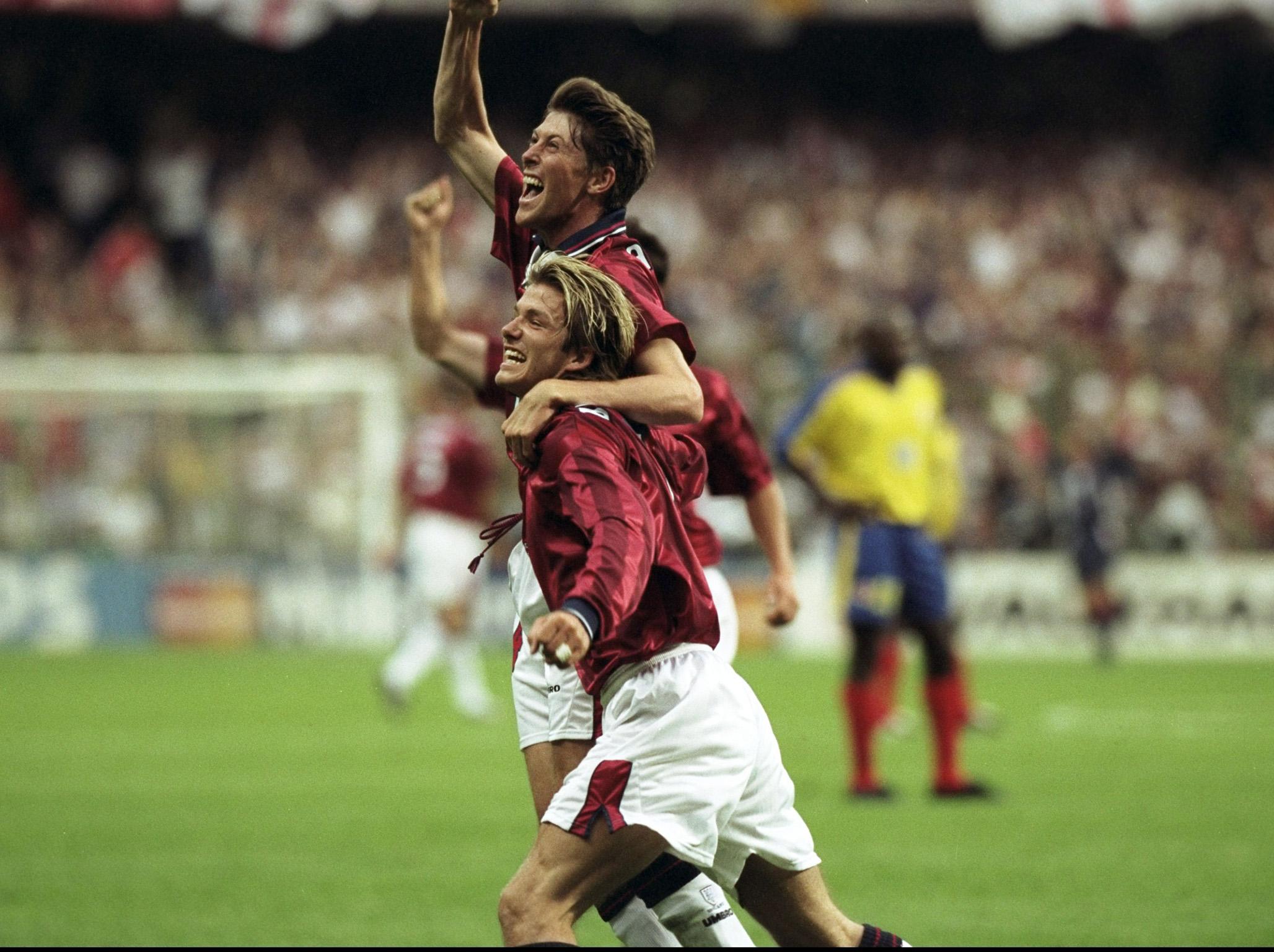 Darren Anderton celebrates scoring against Colombia