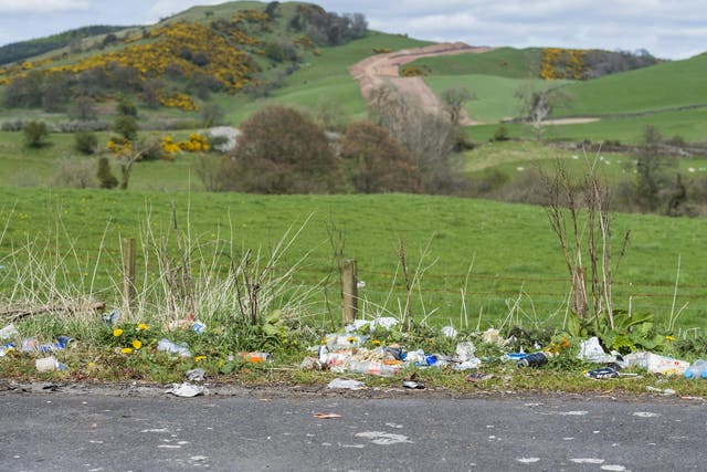 Discarded litter at the side of a rural road near Dumfries in Dumfries and Galloway, south west Scotland
