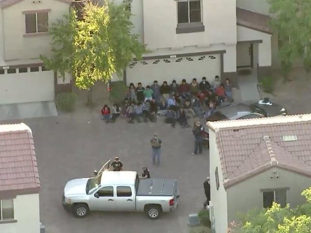 Aerial footage from a local news helicopter from the scene of the US Immigration and Customs Enforcement raid on a home in Phoenix, Arizona on 27 March 2018.