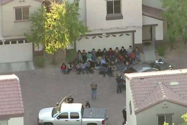 Aerial footage from a local news helicopter from the scene of the US Immigration and Customs Enforcement raid on a home in Phoenix, Arizona on 27 March 2018.