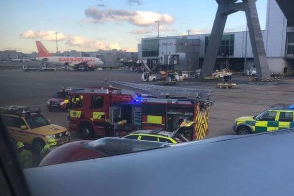 Passengers aboard the Rossiya Airlines plane preparing for takeoff said the emergency services descended onto the airfield and they were told a person had been 'run over'