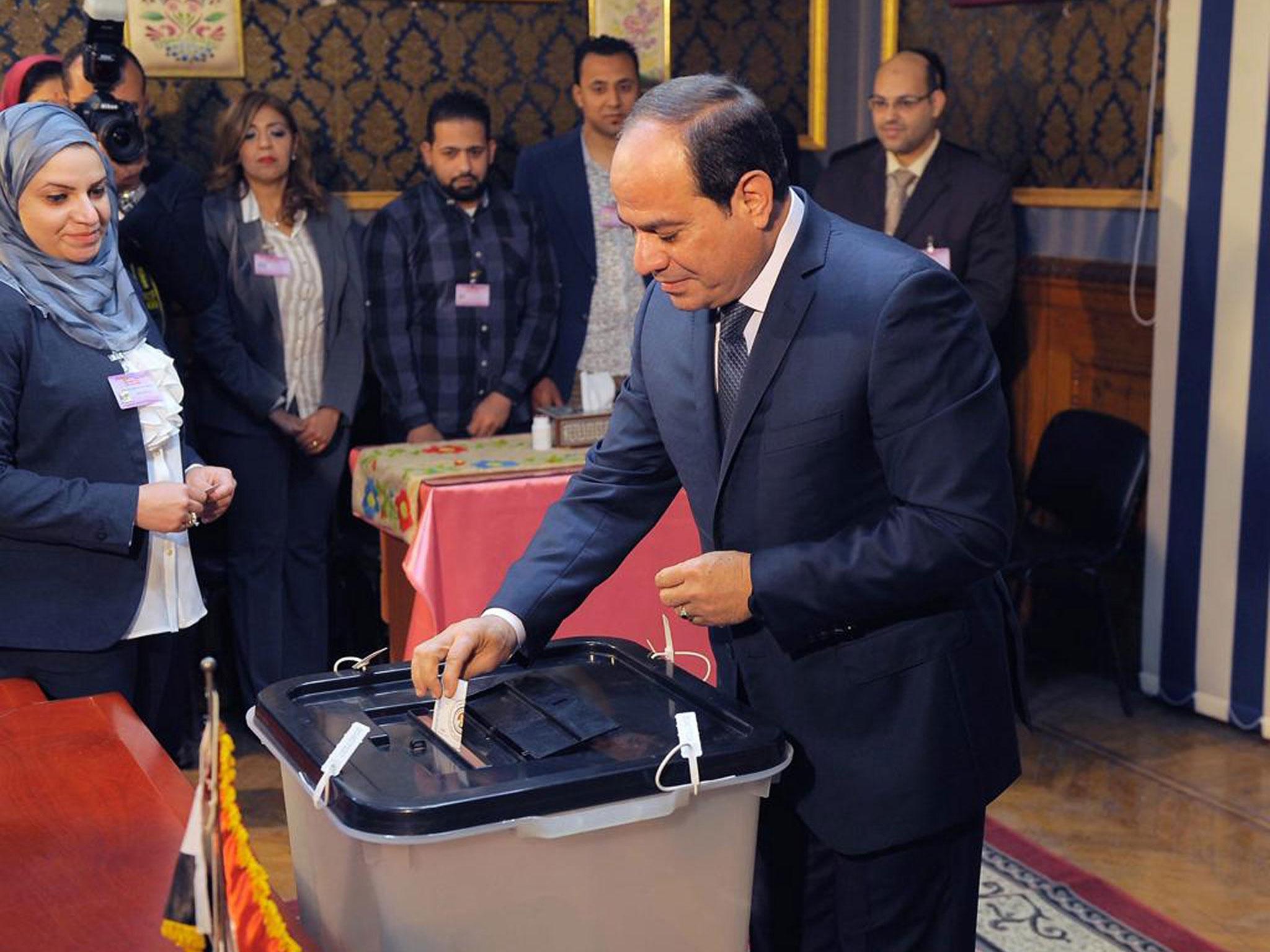 Egyptian President Abdel Fattah al-Sisi casts his ballot. Voting in the election took place over a three-day period, extended for an hour amid very low turnout
