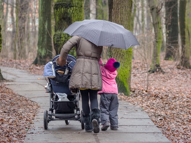 A mother and her daughter walking together