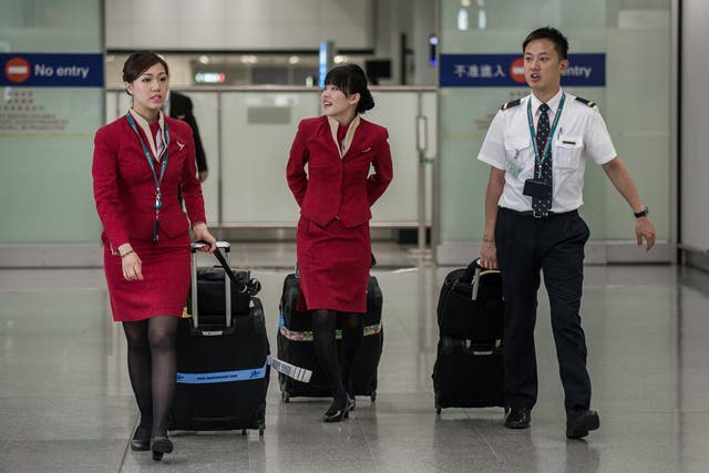 Cathay Pacific flight attendants will soon be able to wear trousers (Getty)