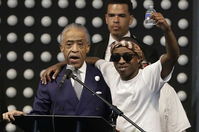 Reverend Al Sharpton with Stevante Clark during the funeral services for Stephon Clark, Stevante's brother, in Sacramento, California