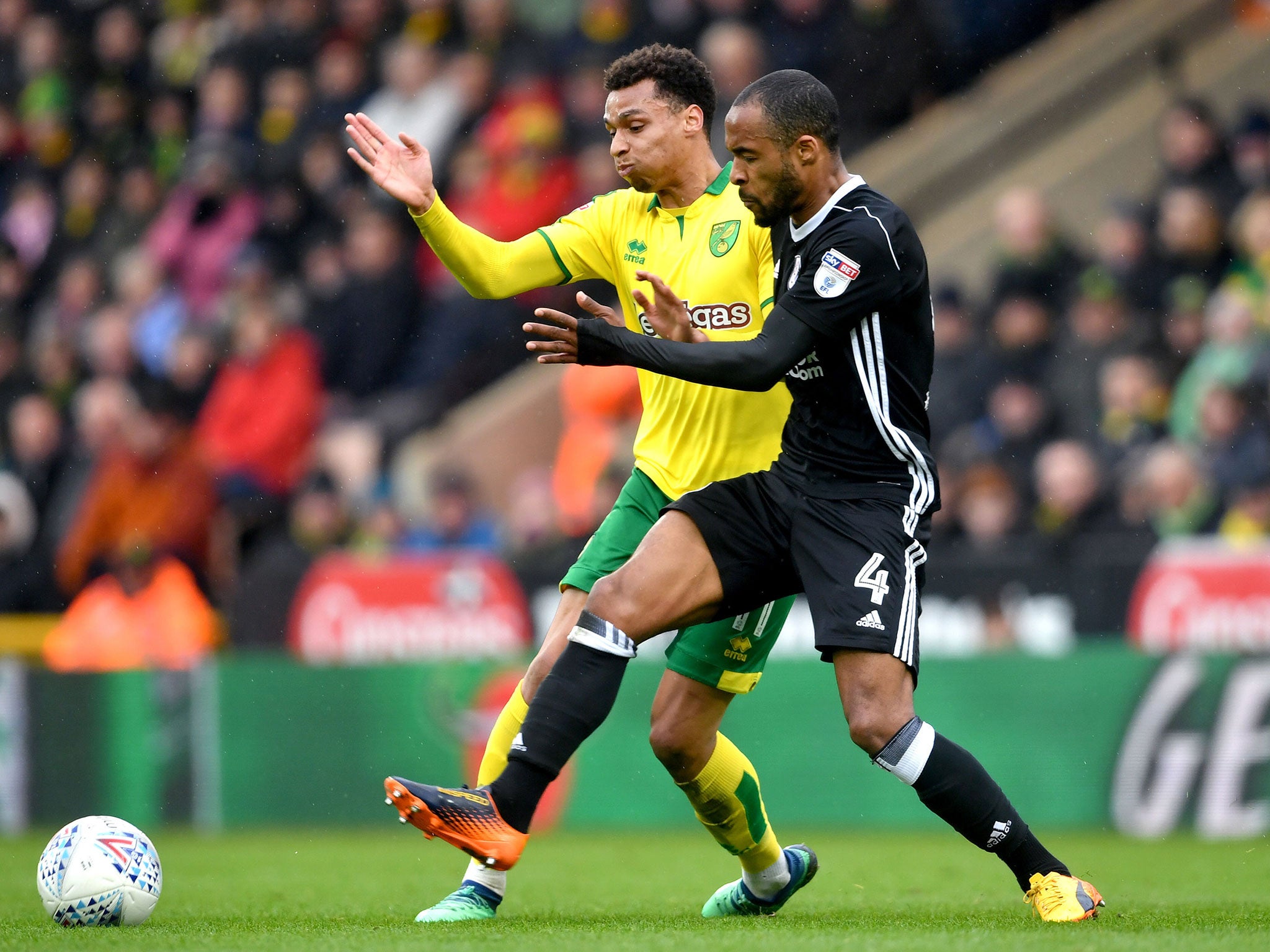 Josh Murphy and Denis Odoi battle for the ball