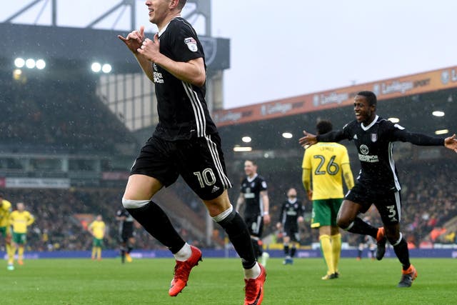 Tom Cairney celebrates after adding Fulham's second