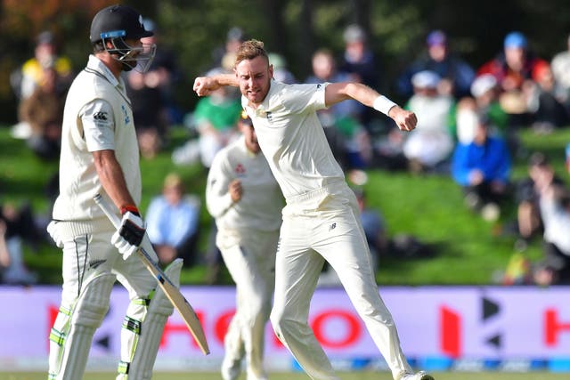 Stuart Broad celebrates taking the crucial wicket of Colin De Grandhomme