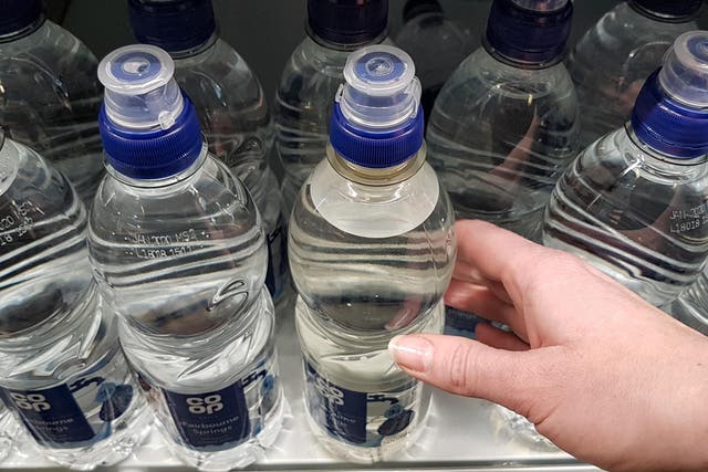 The new part-recycled plastic bottle has a small but noticeable cloudy-grey appearance