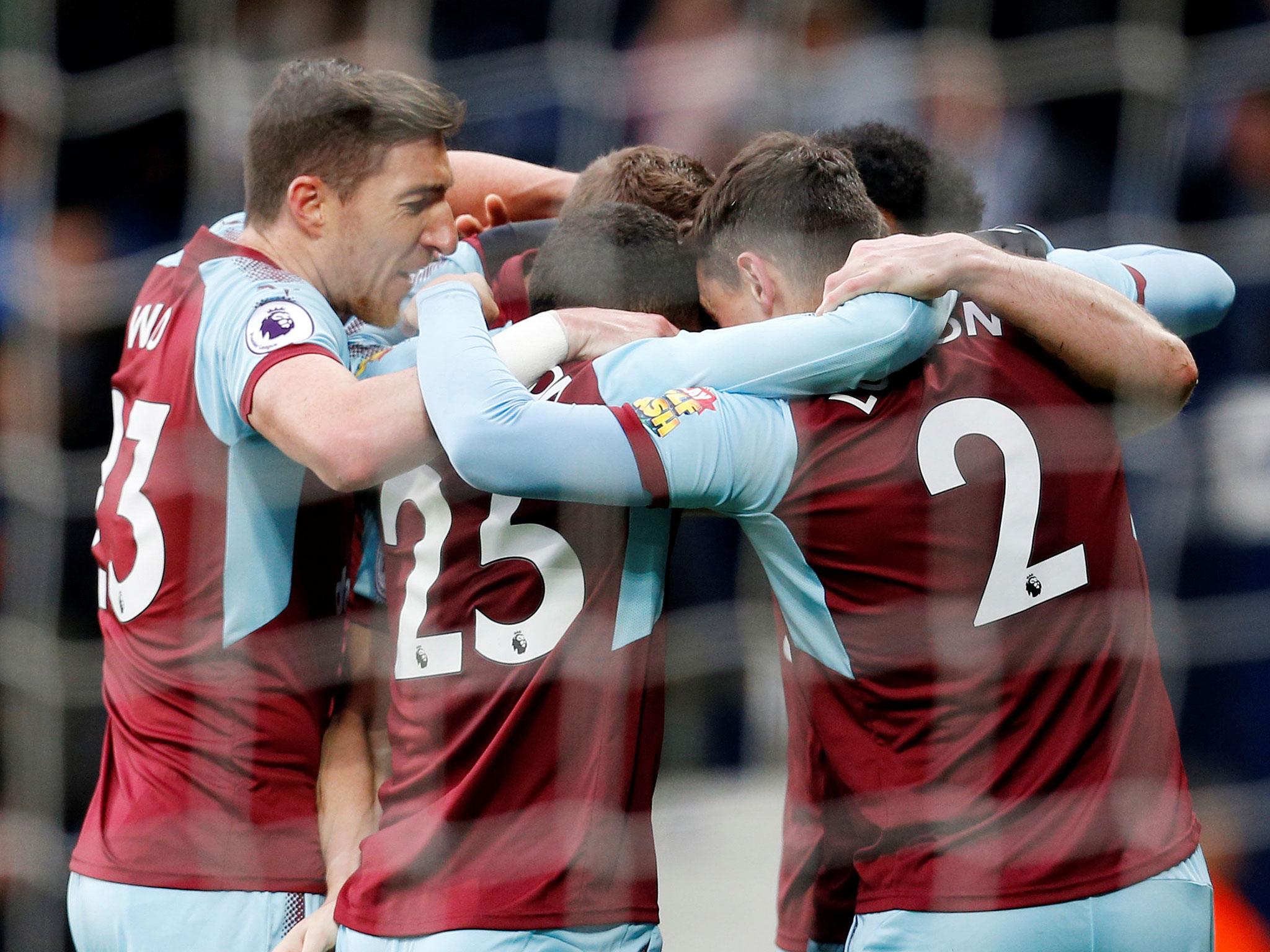 Burnley's players celebrate after Ashley Barnes' opener
