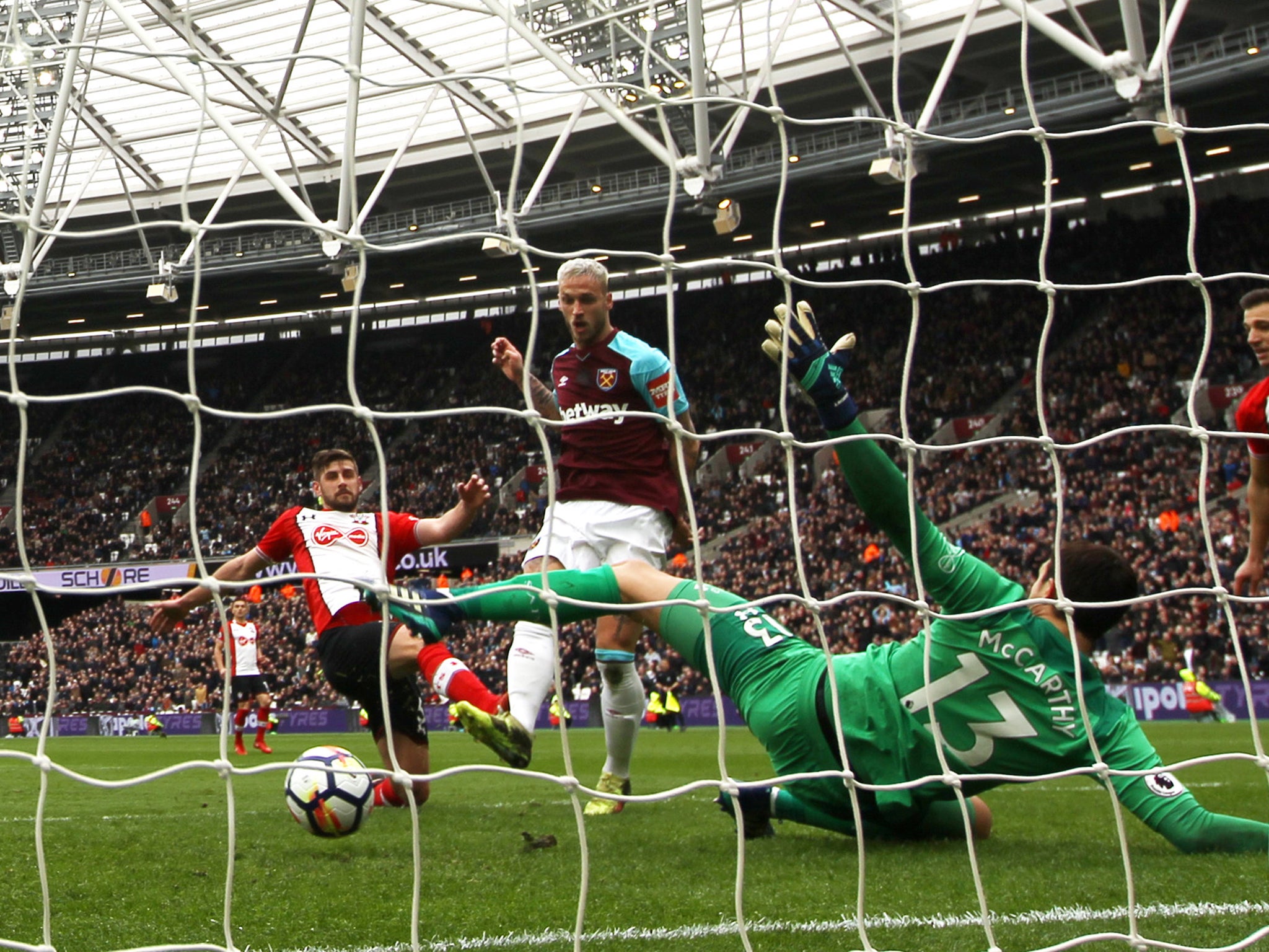 Marko Arnautovic tucks the ball past Alex McCarthy to score for West Ham