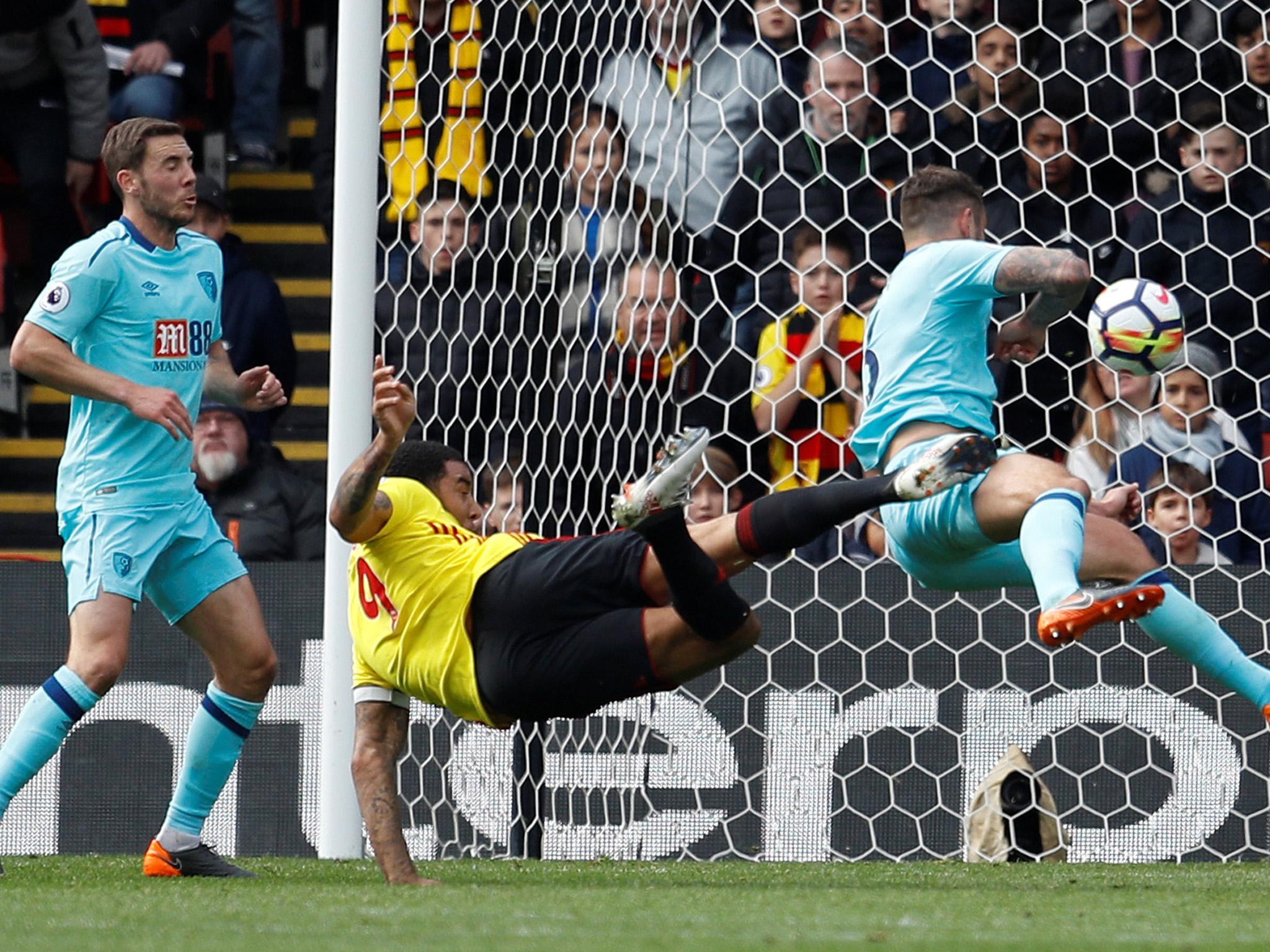 Troy Deeney takes a shot on goal for Watford