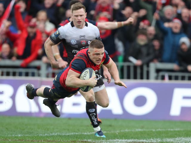 Andrew Conway dives over the line to score Munster's match-winning try