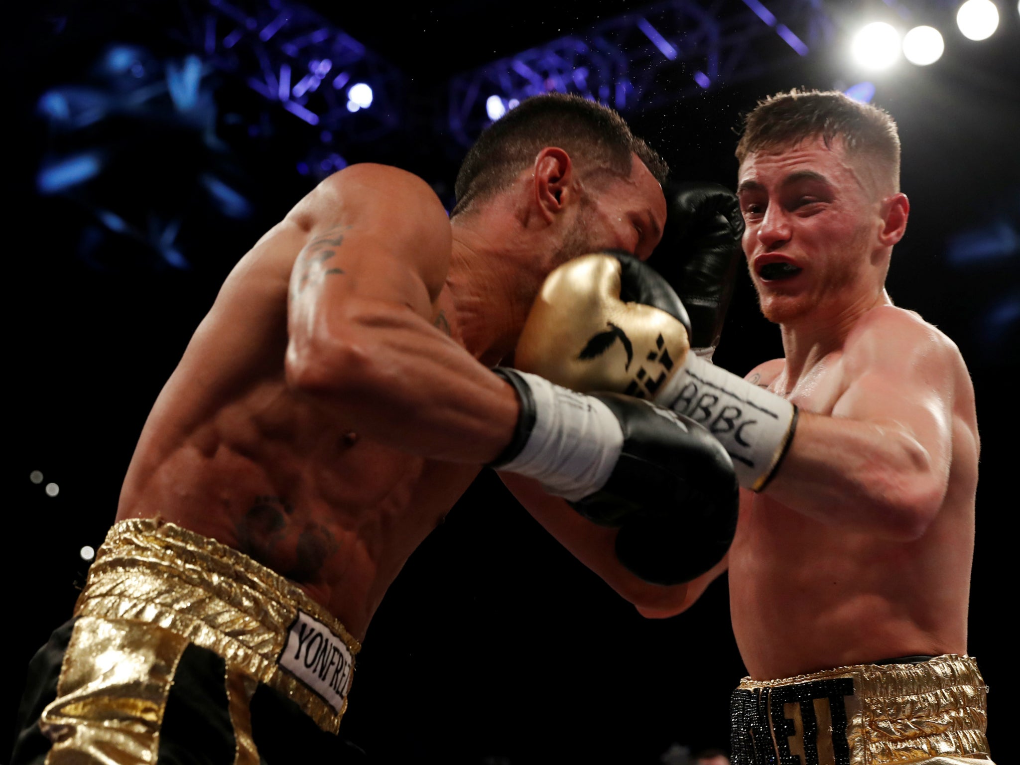 Ryan Burnett lands a left hook on Yonfrez Parejo