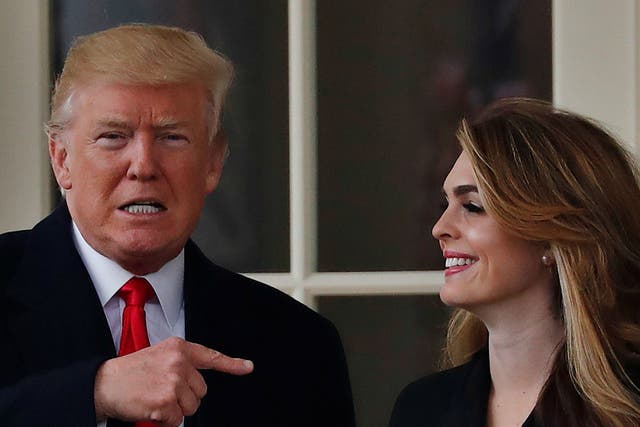 Donald Trump stands next to Hope Hicks outside the Oval Office