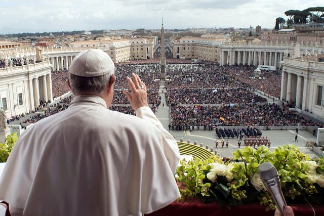 Pope Francis appears before the crowd in St Peter's Square on Easter Sunday