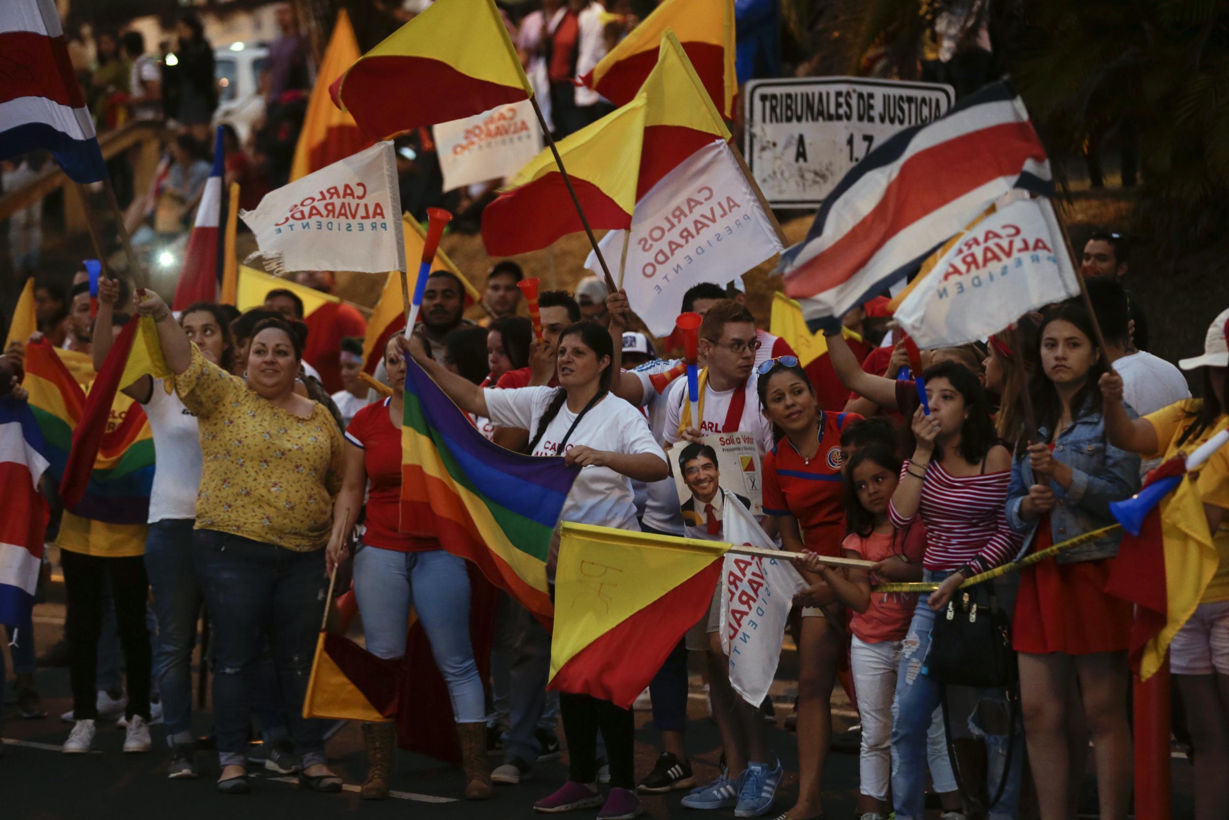 ‘We sent a beautiful democratic message’: supporters of Mr Alvarado celebrate after the polls closed in Costa Rica’s election. The Citizens’ Action Party candidate received a lot of support after his opponent criticised same-sex marriage