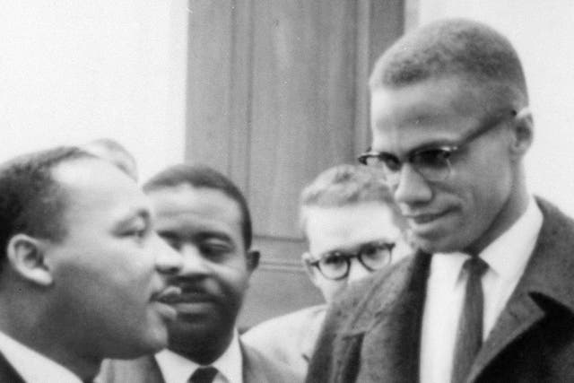 <p>Martin Luther King, Jr, speaks with Malcom X </p>