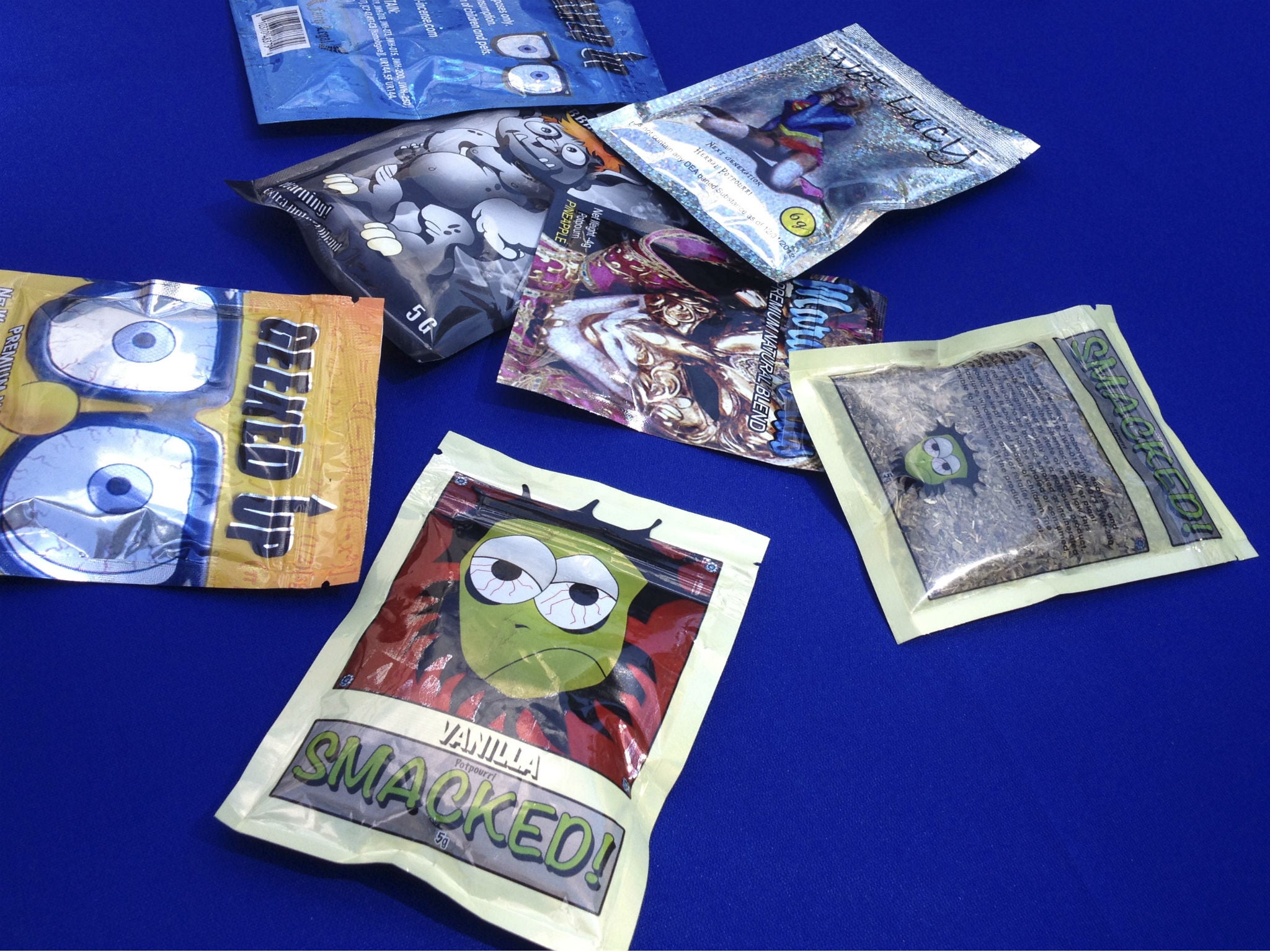 Packets of synthetic marijuana illegally sold in New York City are put on display at a news conference