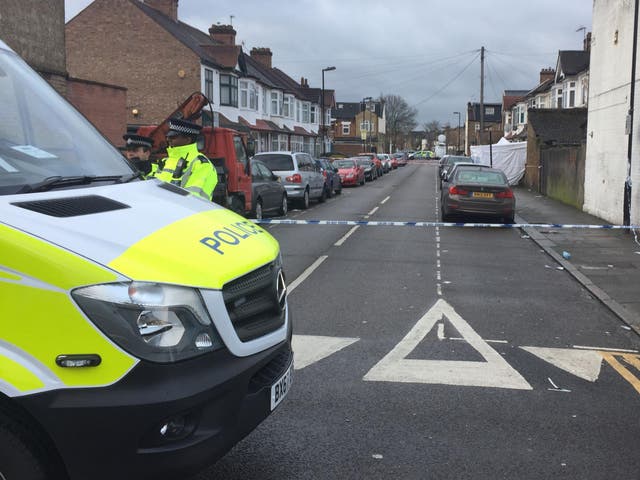 Police next to a cordon at Chalgrove Road, in Tottenham, north London