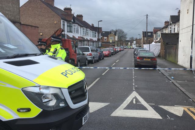 Police next to a cordon at Chalgrove Road, in Tottenham, north London