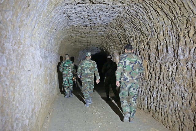 Pro government forces check tunnels used by the rebels over the past years during the siege in the recently conquered area of Jobar, in eastern Ghouta on 3 April, 2018