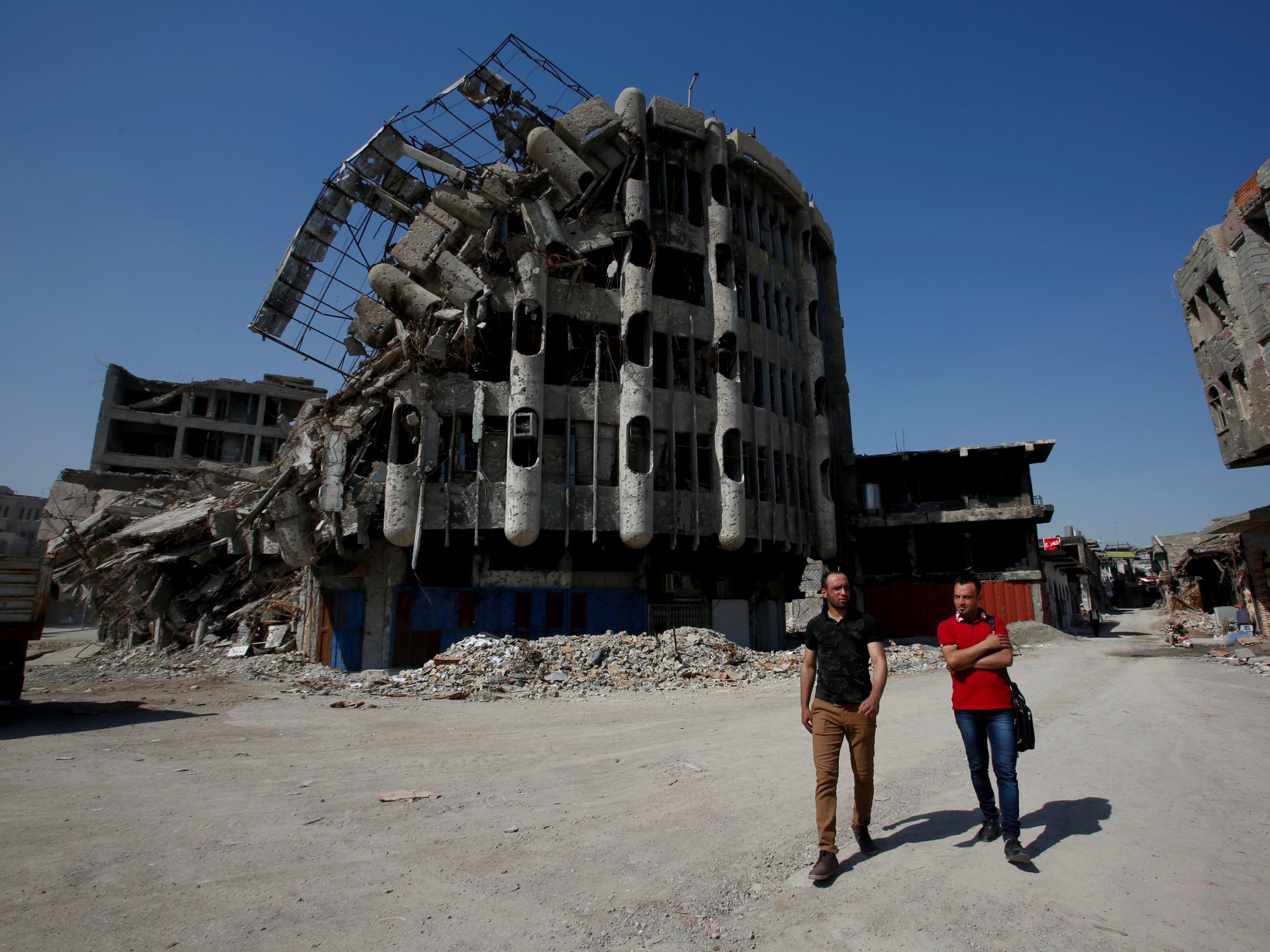 A damaged building in Mosul testifies to violence that continues to dog the country