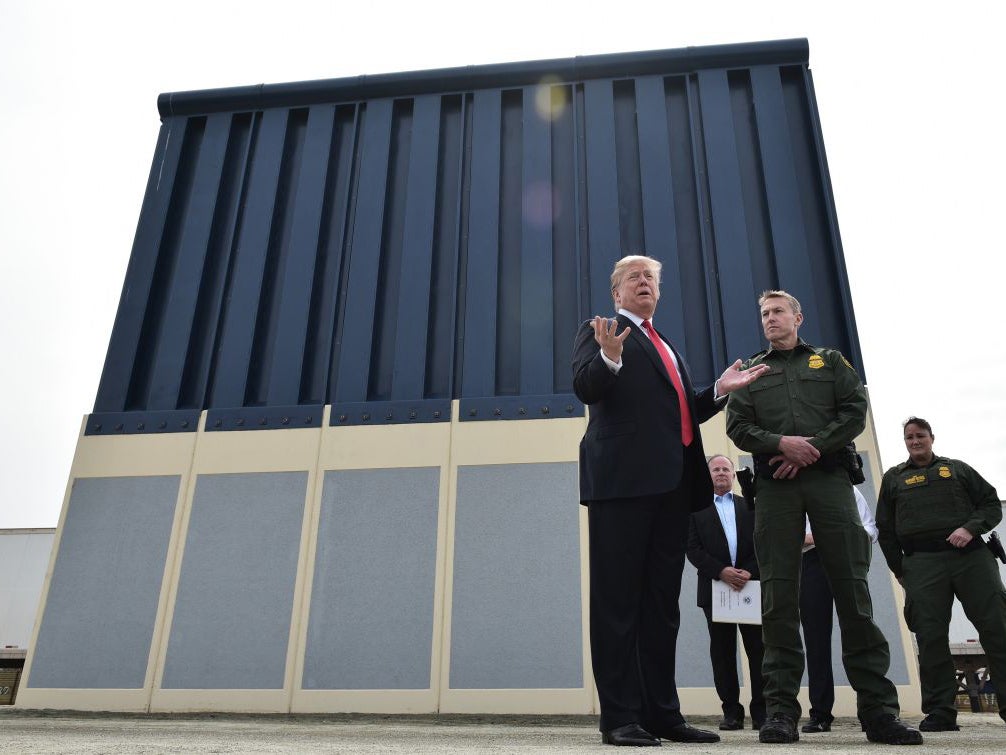 Donald Trump inspecting the border wall on the Mexican border in 2018