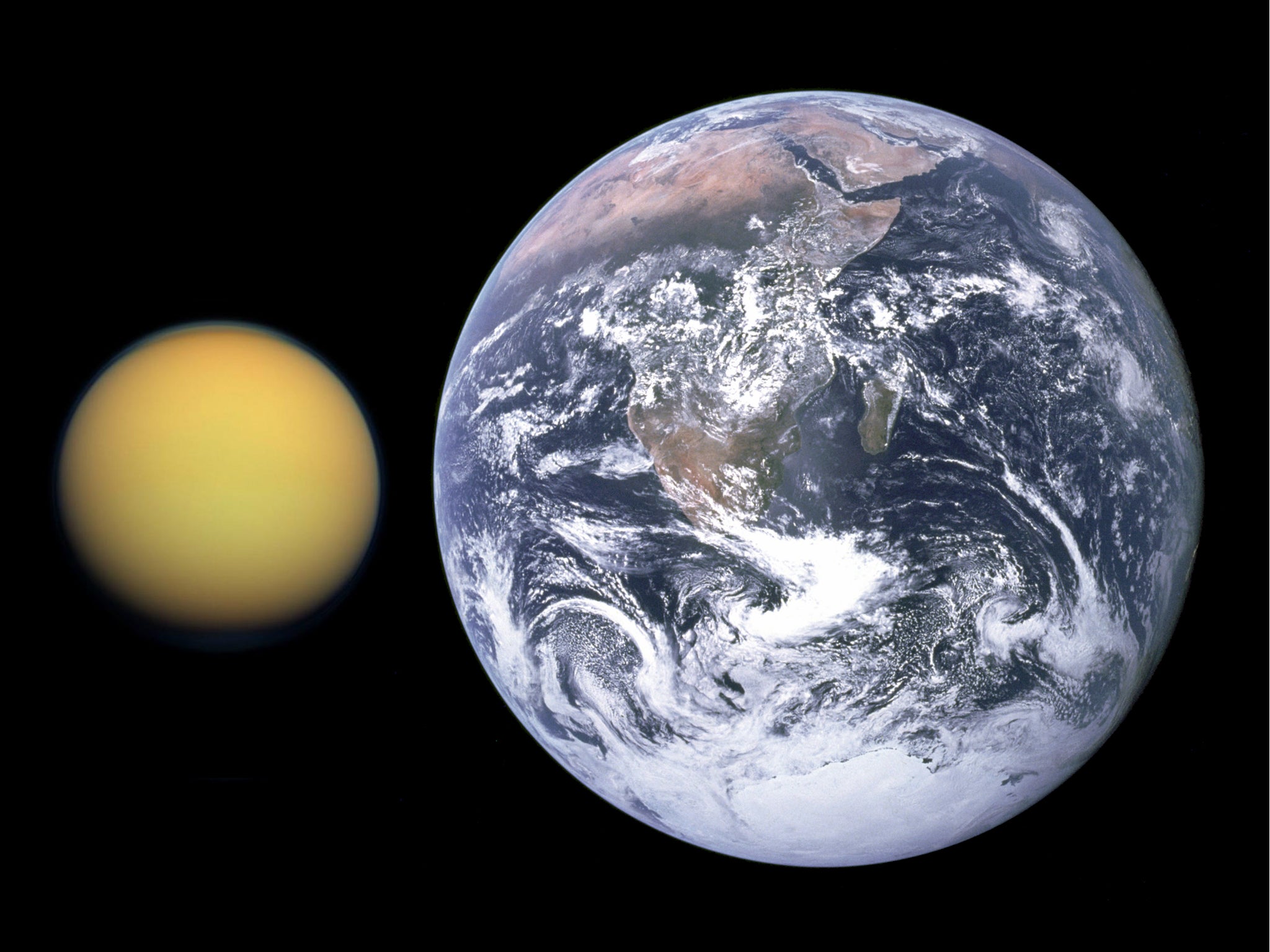 Saturn’s moon Titan, as it compares in size to Earth. Both Titan and Earth were used by researchers to train a neural network to recognize whether exoplanets hold the potential for alien life.