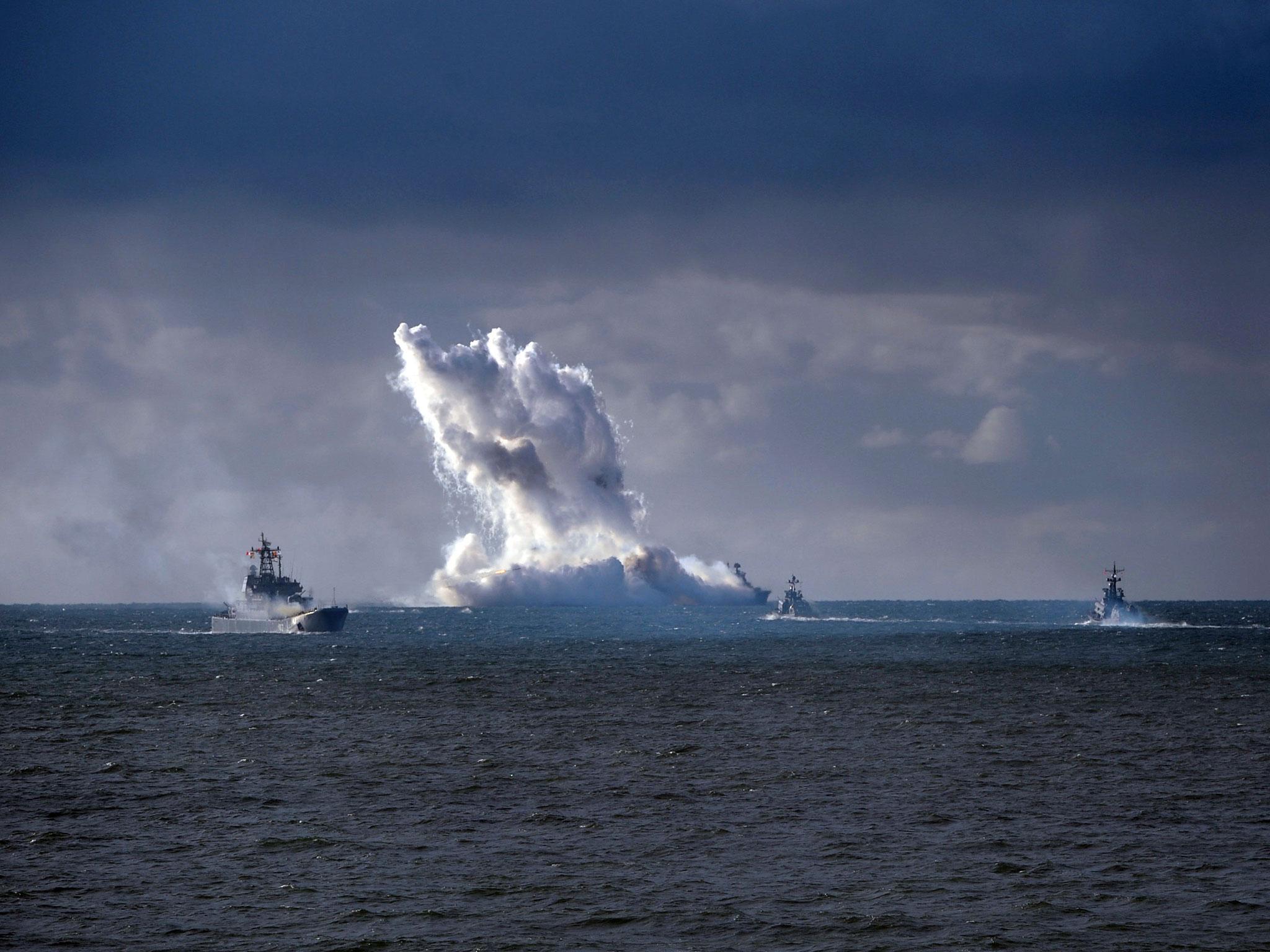 Russian military vessels conduct drills during the joint war games Zapad-2013, in the Baltic Sea