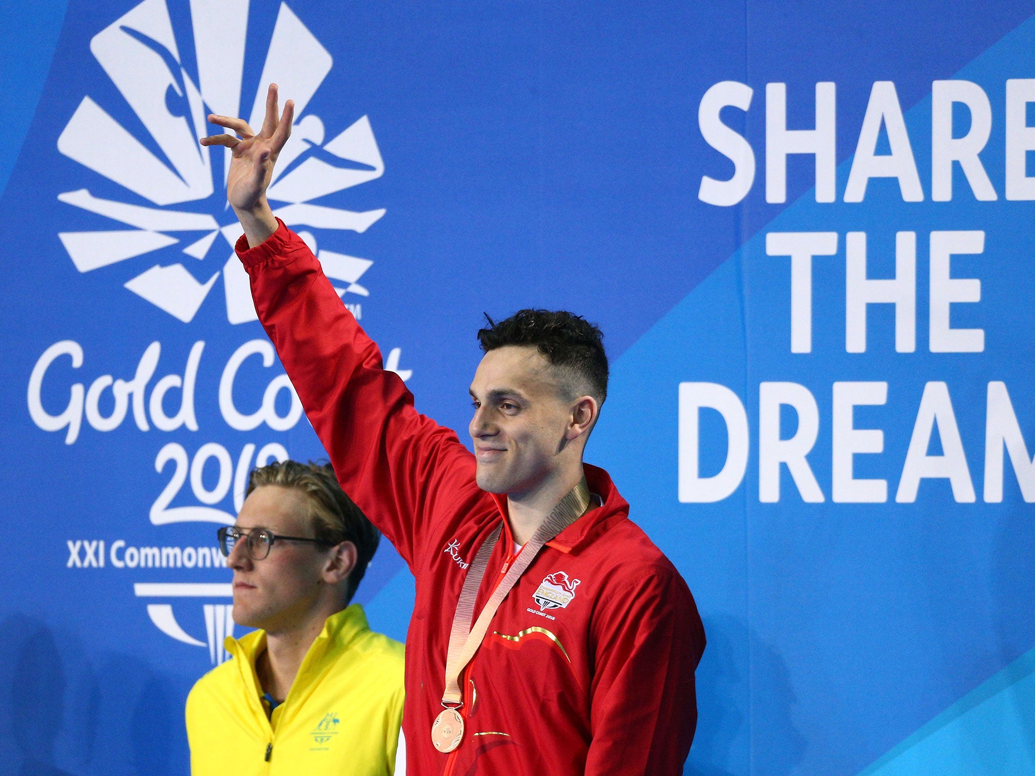 James Guy with his bronze medal on the podium