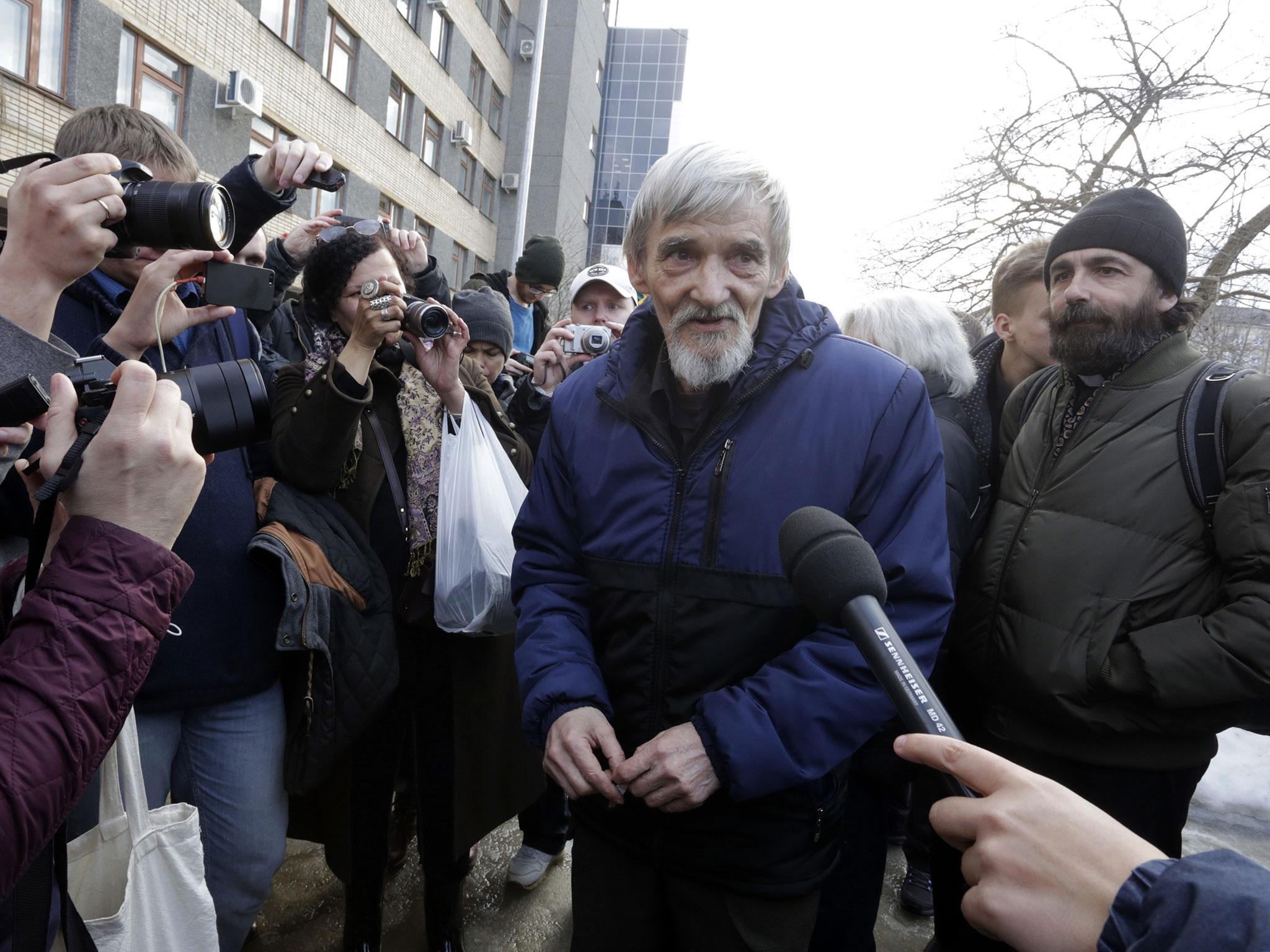 Russian historian Yuri Dmitriyev leaves court in the city of Petrozavodsk, northwest Russia