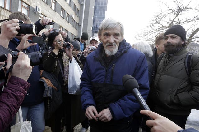 Russian historian Yuri Dmitriyev leaves court in the city of Petrozavodsk, northwest Russia