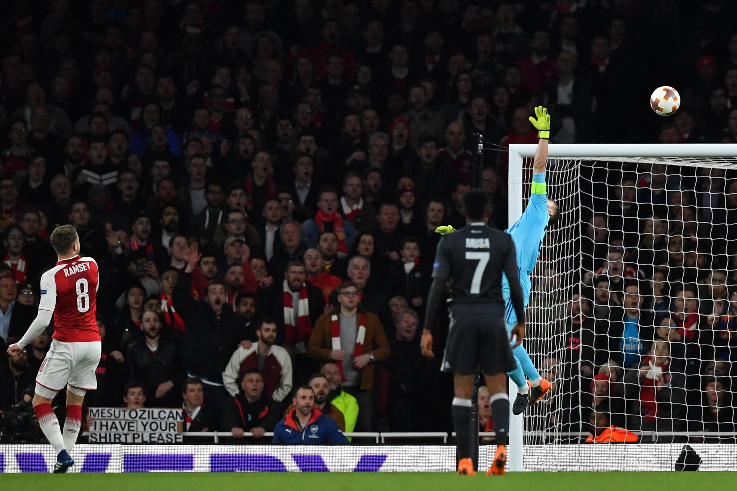 Aaron Ramsey loops a finish over Igor Akinfeev