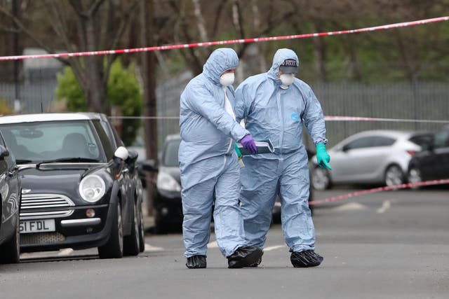 Forensic officers on Further Green Road in Hither Green, London