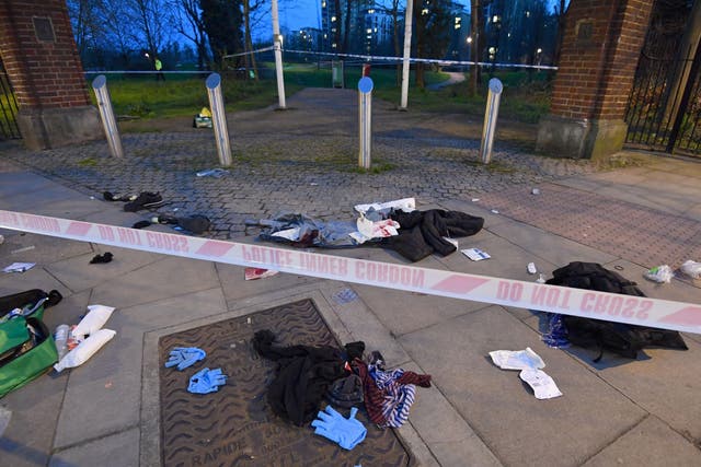 Bloodied clothes on the ground near the scene of a stabbing in Grove Road, Mile End
