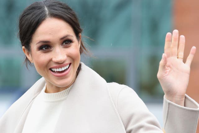 Related video: Meghan Markle ignores royal protocol by hugging a woman that gave her a compliment