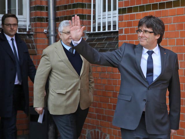 Carles Puigdemont and political colleagues give the thumbs-up after last year's referendum 