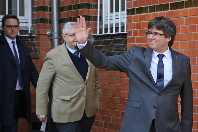 Carles Puigdemont and political colleagues give the thumbs-up after last year's referendum 