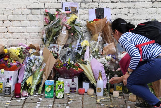 Flowers and tributes left for 18-year-old Israel Ogunsola, who was stabbed to death in Hackney last April