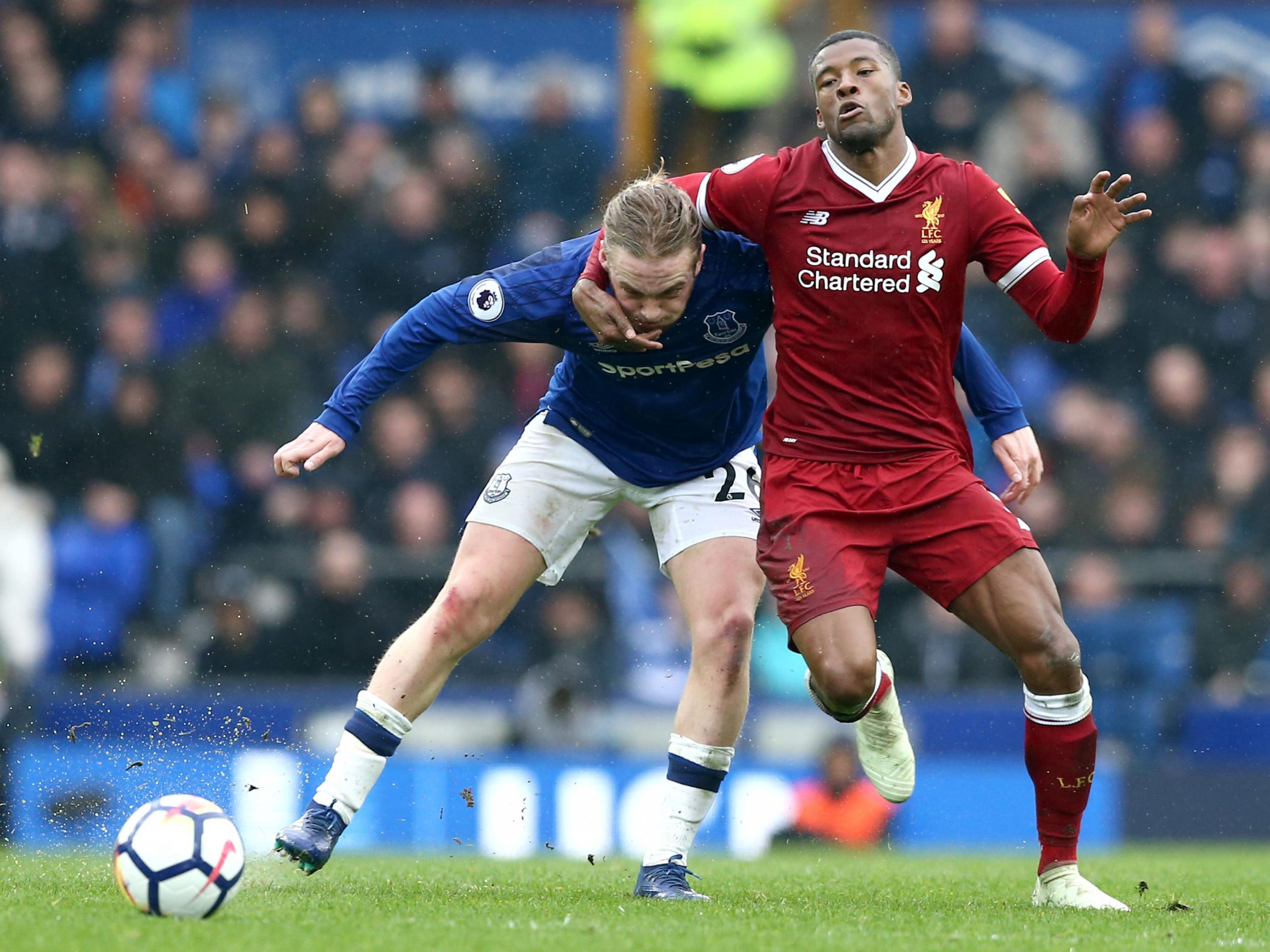 Tom Davies and Georginio Wijnaldum compete for posesession