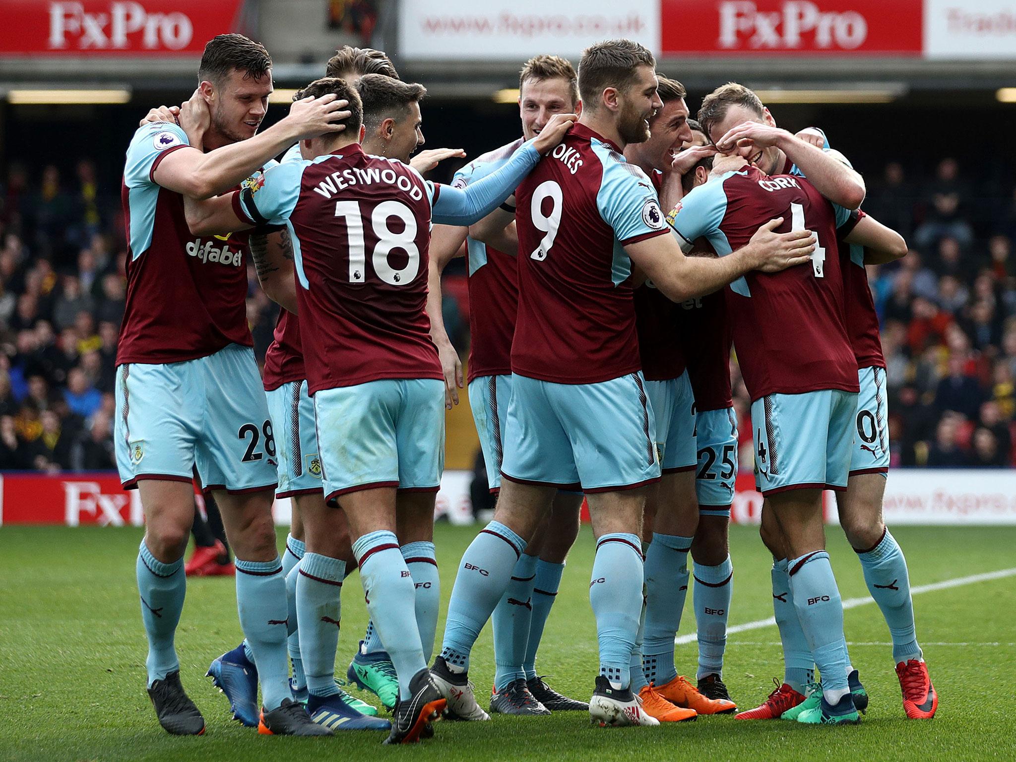 Jack Cork celebrates with his team-mates after scoring Burnley's second