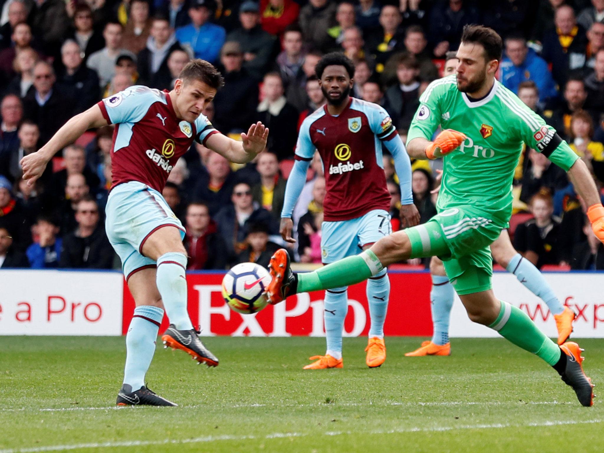 Orestis Karnezis rushes to clear his line