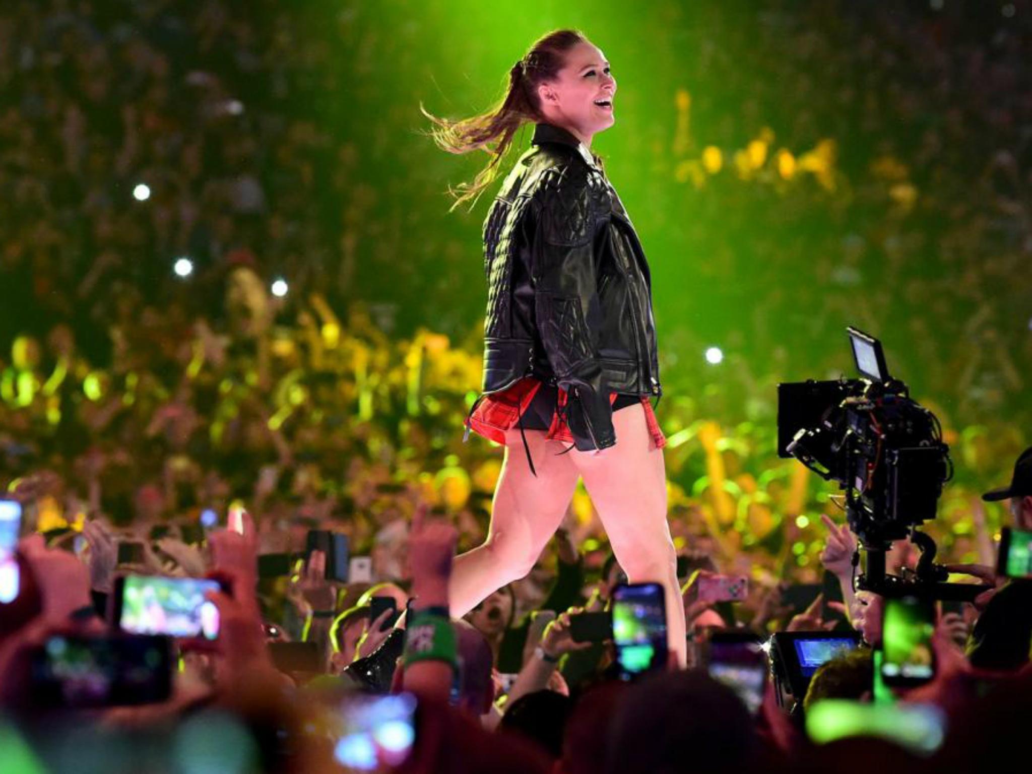 A beaming Rousey soaked up the atmosphere on her way to the ring (WWE)