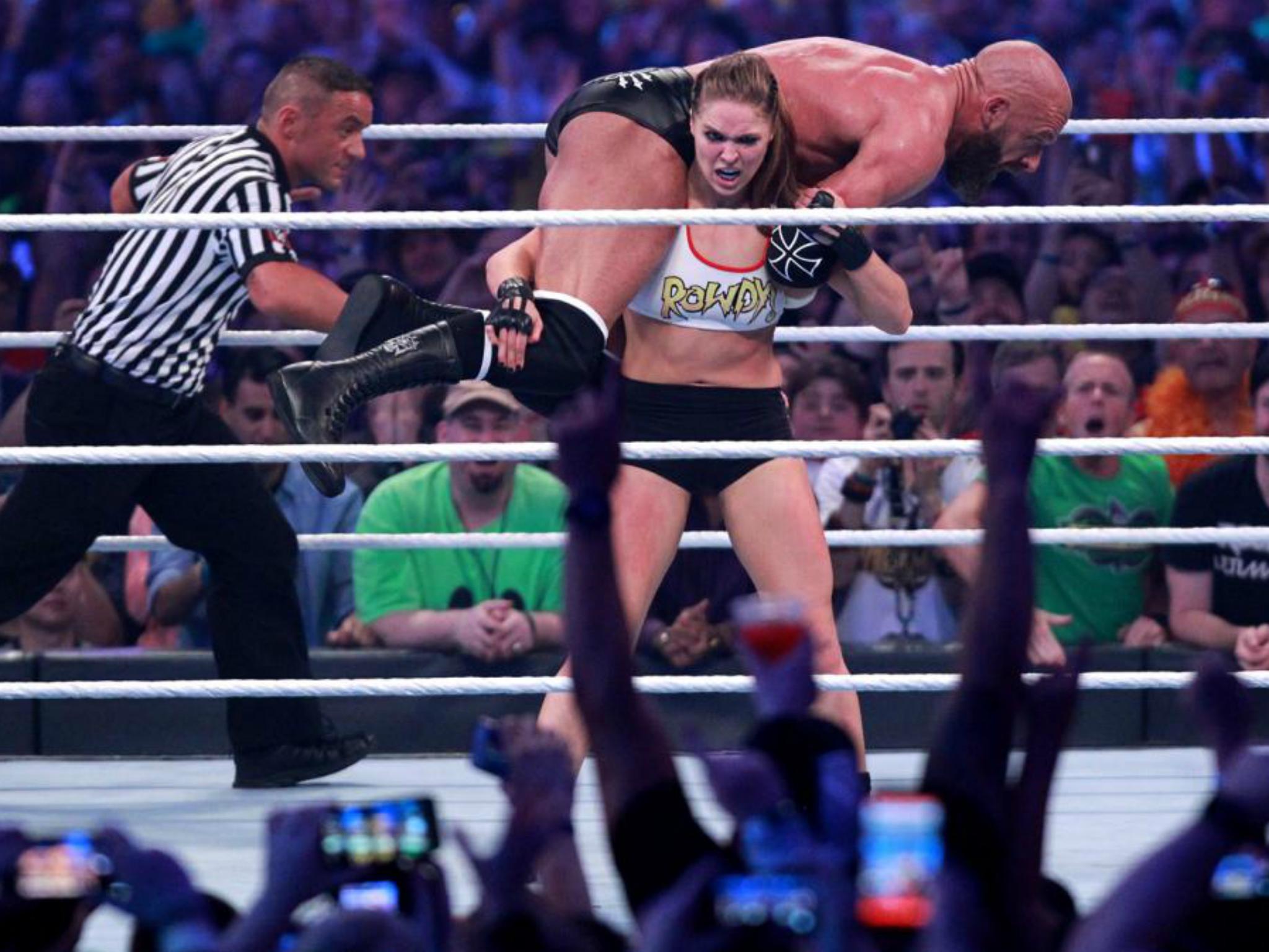 Rousey picked up Triple h during their match?(WWE)