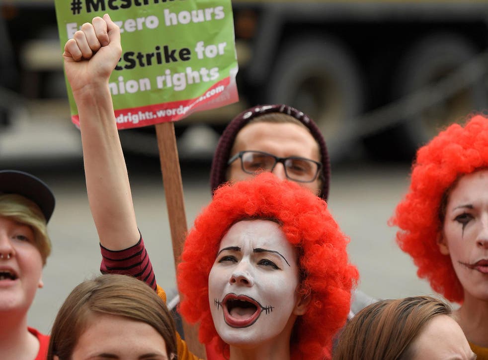 Protestors demonstrate in support of McDonald's workers striking over pay and other issues in London, September 2017
