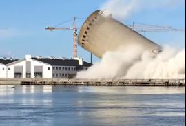 174ft tower collapses in wrong direction during demolition, crushing cultural centre